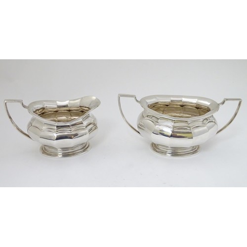 493 - A silver plate 4 piece tea set comprising teapot, hot water pot, sugar and cream jug (4)