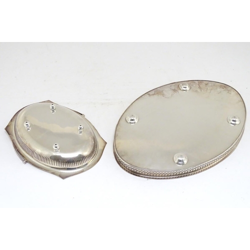 500 - A silver plated oval tray with galleried side together with a cake basket with swing over handle. Th... 