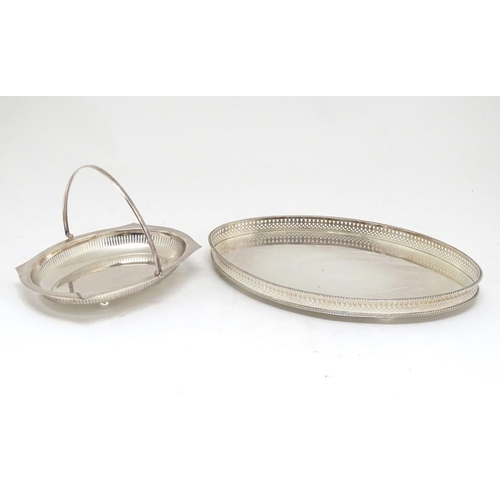 500 - A silver plated oval tray with galleried side together with a cake basket with swing over handle. Th... 