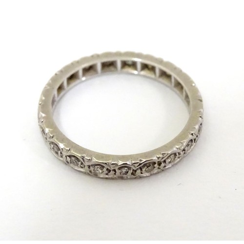 508 - A white gold eternity ring set with band of diamonds. Ring size approx M 1/2