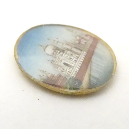 549 - A small cabochon depicting a miniature hand painted scene depicting the Taj Mahal. Approx. 3/4