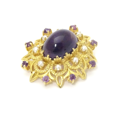 580 - A 9ct gold brooch set with central oval cabochon amethyst surrounded by eight seed
pearls, further s... 