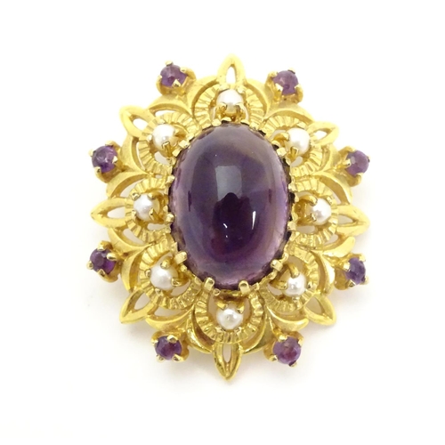 580 - A 9ct gold brooch set with central oval cabochon amethyst surrounded by eight seed
pearls, further s... 