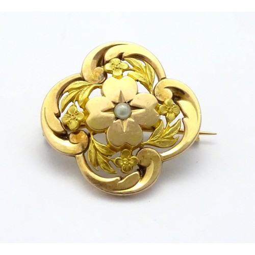 596 - A 9ct gold brooch set with central seed pearl 1'' diameter