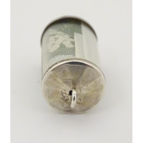 611 - A novelty pendant charm of cylindrical form and containing a £1 note. Approx 3 /4'' long