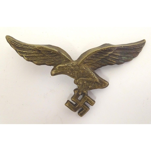 665 - Militaria: a WWII / WW2 / Second World War Luftwaffe metal cap badge, 2 5/8