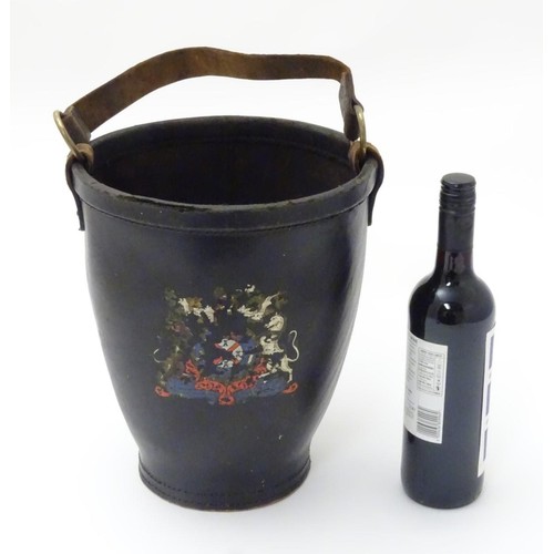 670 - A leather fire bucket with traces of polychrome decoration of the Royal coat of arms. Impressed Made... 