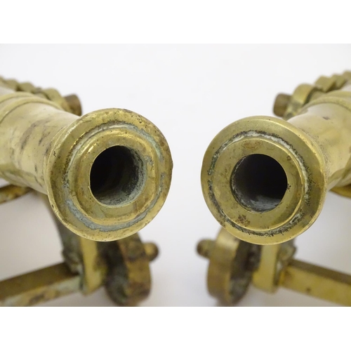 678 - Militaria: a pair of early 20thC cast brass model desk cannons, each 8 1/4