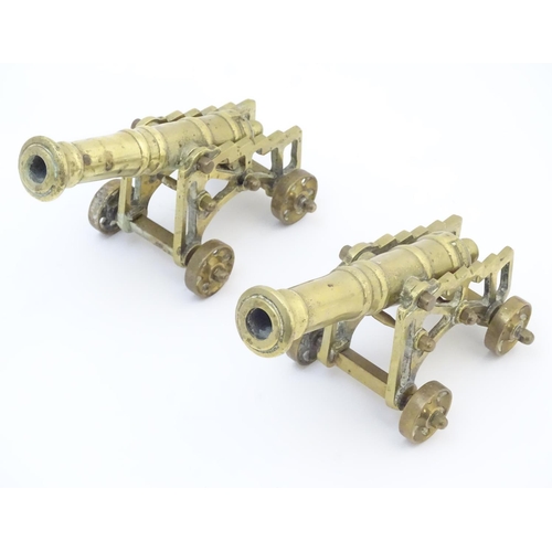 678 - Militaria: a pair of early 20thC cast brass model desk cannons, each 8 1/4