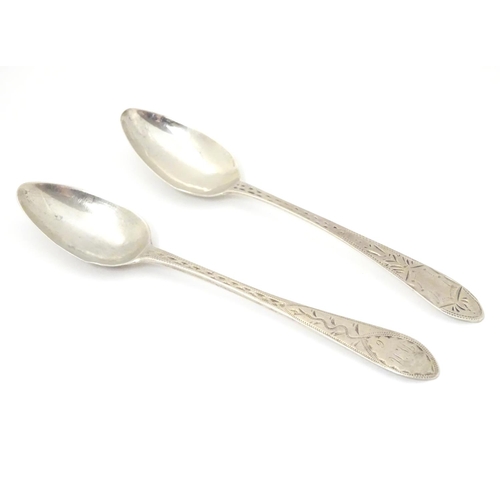 233 - Two Geo III Scottish Celtic point teaspoons with bright cut decoration  5 1/4