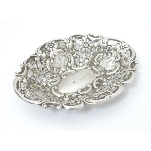 234 - A Victorian silver bon bon dish with embossed decoration. Hallmarked Birmingham 1899, Benjamin Thoma... 