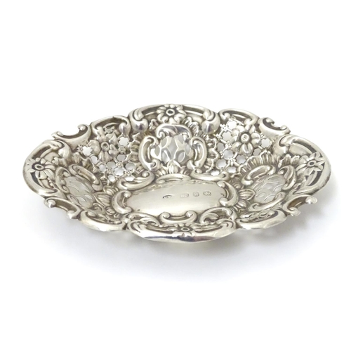 234 - A Victorian silver bon bon dish with embossed decoration. Hallmarked Birmingham 1899, Benjamin Thoma... 