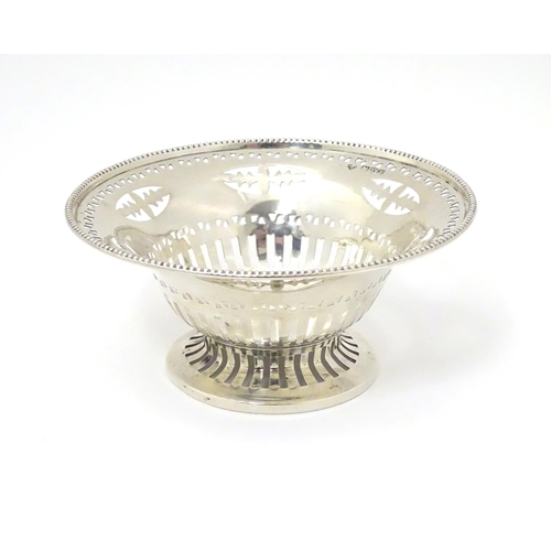 237 - A silver bonbon dish with beaded edge and pierced decoration raised on circular foot. Hallmarked Che... 