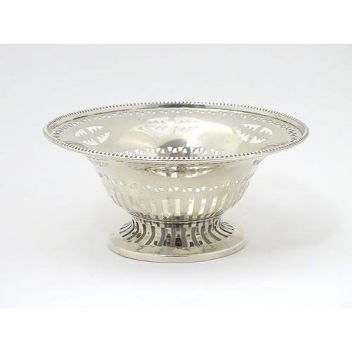 237 - A silver bonbon dish with beaded edge and pierced decoration raised on circular foot. Hallmarked Che... 