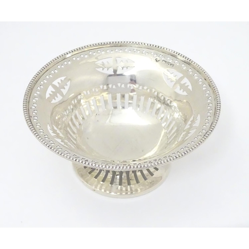 237 - A silver bonbon dish with beaded edge and pierced decoration raised on circular foot. Hallmarked Che... 