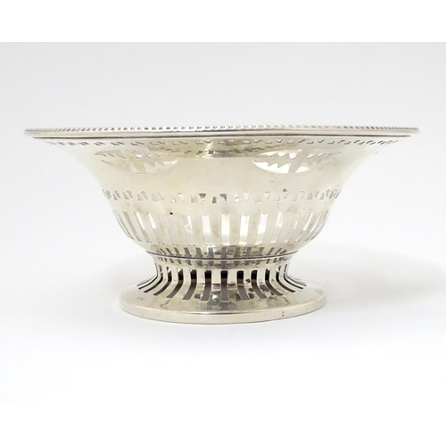 237 - A silver bonbon dish with beaded edge and pierced decoration raised on circular foot. Hallmarked Che... 