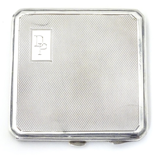 241 - An Art Deco silver compact with engine turned decoration. Hallmarked Birmingham 1947maker Joseph Glo... 