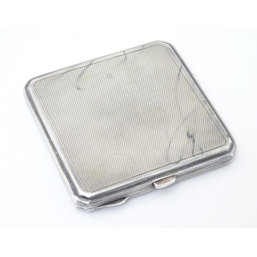 241 - An Art Deco silver compact with engine turned decoration. Hallmarked Birmingham 1947maker Joseph Glo... 