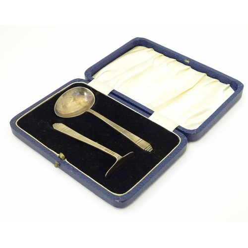 243 - An Art Deco child's silver pusher and spoon hallmarked Sheffield 1935/36 maker C W Fletcher & Son Lt... 