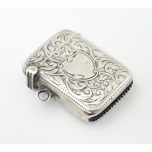 247 - A silver vesta case with engraved decoration. Hallmarked Birmingham 1913 maker Joseph Gloster Ltd.  ... 