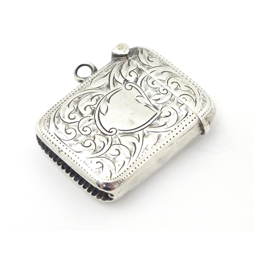 247 - A silver vesta case with engraved decoration. Hallmarked Birmingham 1913 maker Joseph Gloster Ltd.  ... 