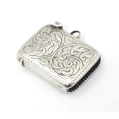 247 - A silver vesta case with engraved decoration. Hallmarked Birmingham 1913 maker Joseph Gloster Ltd.  ... 