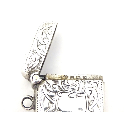 247 - A silver vesta case with engraved decoration. Hallmarked Birmingham 1913 maker Joseph Gloster Ltd.  ... 