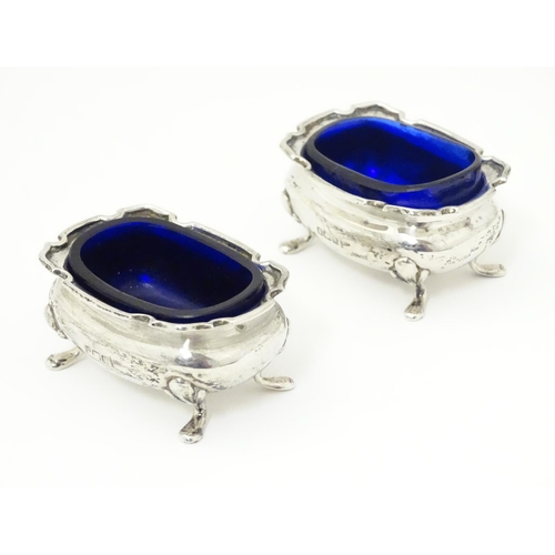 250 - A pair of silver salts with blue glass liners, hallmarked Sheffield 1908 maker Walker & Hall.  2 1/2... 