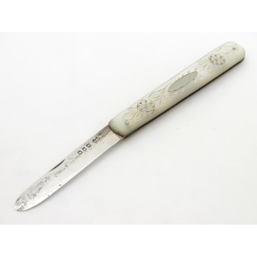 255 - A Victorian silver folding fruit knife with mother of pearl handle having engraved decoration. Hallm... 