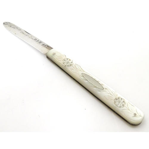 255 - A Victorian silver folding fruit knife with mother of pearl handle having engraved decoration. Hallm... 