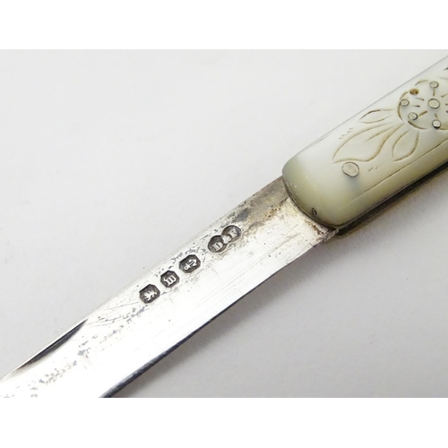 255 - A Victorian silver folding fruit knife with mother of pearl handle having engraved decoration. Hallm... 