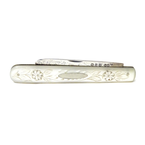 255 - A Victorian silver folding fruit knife with mother of pearl handle having engraved decoration. Hallm... 