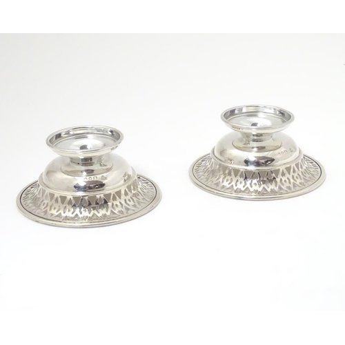 259 - A pair of silver pedestal bonbon dishes with pierced decoration. Hallmarked London 1966 maker A. Chi... 