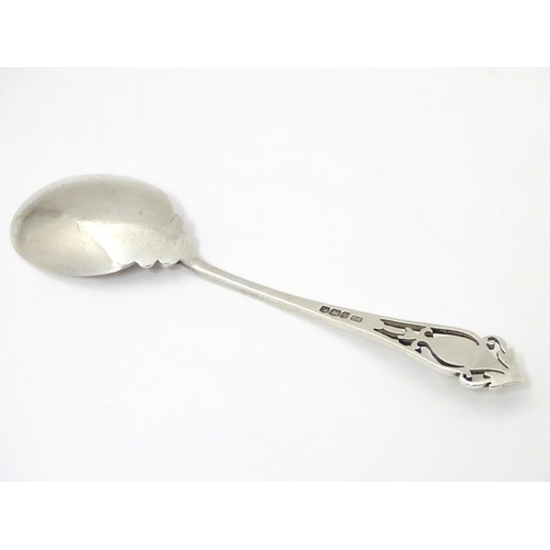 260 - A silver jam / preserve spoon with fretwork decoration to handle, hallmarked Sheffield 1933 maker Ha... 