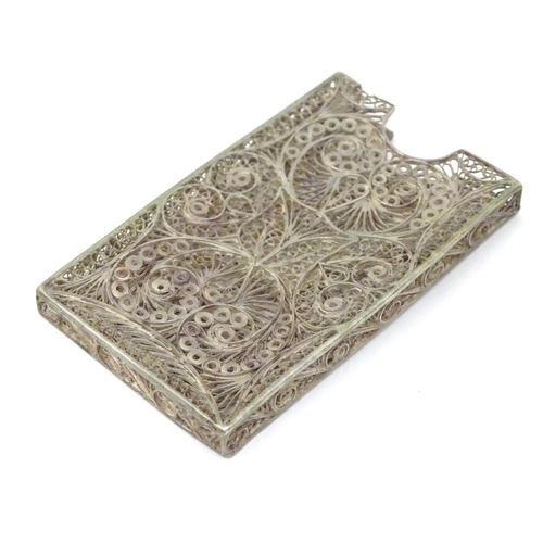 263 - A white metal card vase with filigree decoration .  3