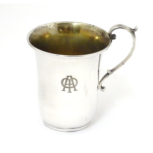 269 - A Continental 925 silver mug with scrolled handle. Marked under in Greek Approx. 3