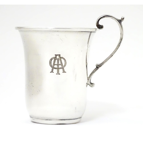 269 - A Continental 925 silver mug with scrolled handle. Marked under in Greek Approx. 3