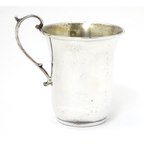 269 - A Continental 925 silver mug with scrolled handle. Marked under in Greek Approx. 3