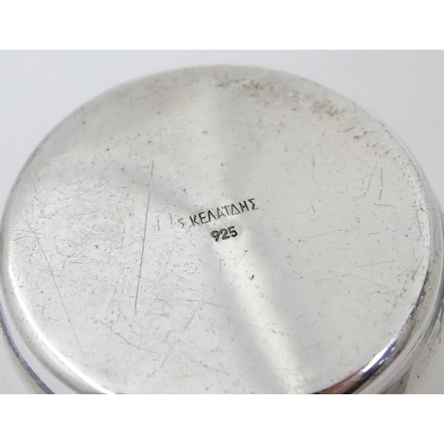 269 - A Continental 925 silver mug with scrolled handle. Marked under in Greek Approx. 3