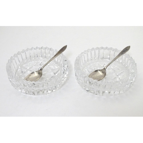 277 - A cased pair of cut glass preserve / conserve  dishes with silver spoons Hallmarked Birmingham 1934 ... 