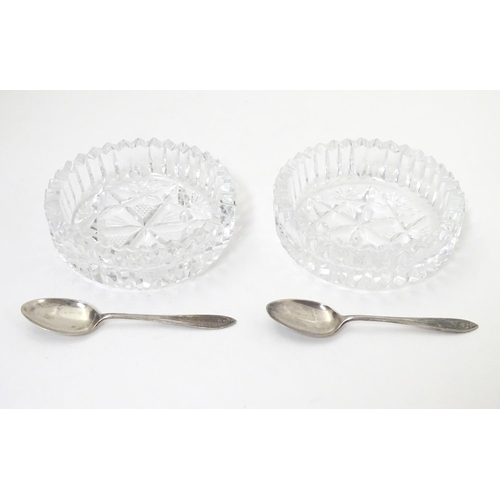 277 - A cased pair of cut glass preserve / conserve  dishes with silver spoons Hallmarked Birmingham 1934 ... 