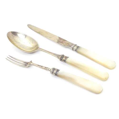 278 - A silver three piece christening set comprising knife, fork and spoon with mother of pearl handles. ... 