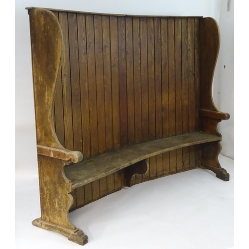 1562 - A 19thC tavern settle with an elm seat, planked bow back and shaped sides with scrolled armrests. 93... 