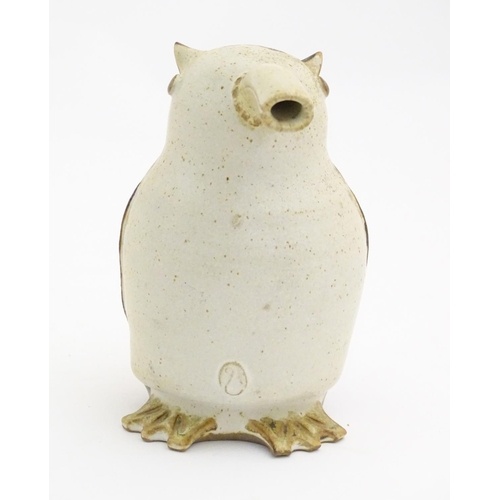 103 - A studio pottery model of a bird with an elongated beak. Impressed marks above feet. Approx. 6 1/4