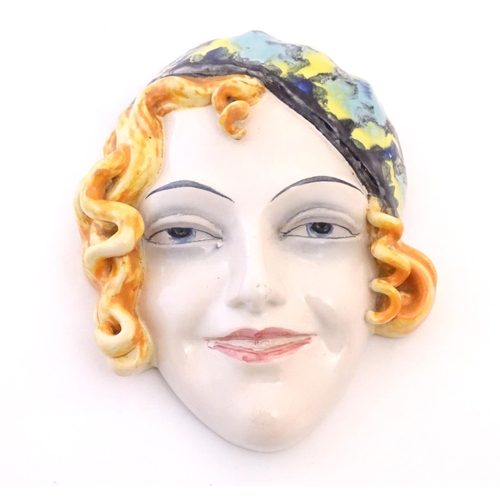 137 - WITHDRAWN FROM AUCTION - Apologies for any inconvenience. An Art Deco Goebel wall mask depicting the... 