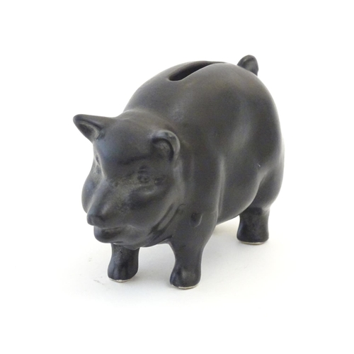 146 - A Sylvac matte black money / piggy bank modelled as a pot bellied pig, no. 1132. Approx. 3