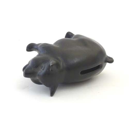 146 - A Sylvac matte black money / piggy bank modelled as a pot bellied pig, no. 1132. Approx. 3