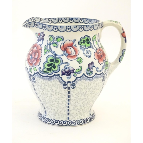 147 - A Maling jug of baluster form with floral and foliate detail. Marked under. Approx. 7 1/4