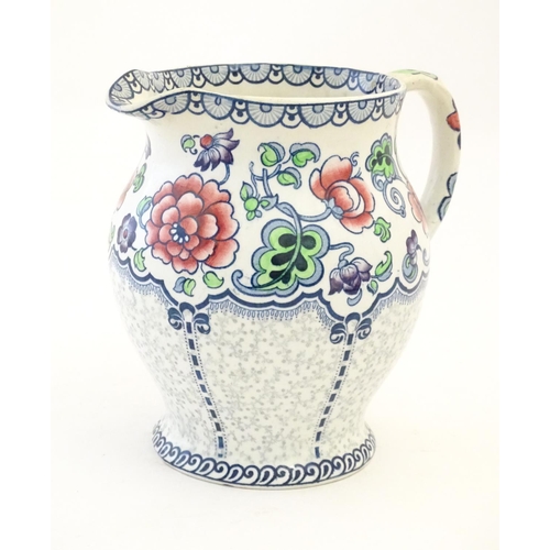 147 - A Maling jug of baluster form with floral and foliate detail. Marked under. Approx. 7 1/4