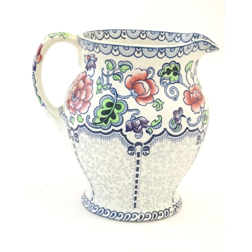 147 - A Maling jug of baluster form with floral and foliate detail. Marked under. Approx. 7 1/4